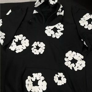 Denim Tears Black Hoodie with White Floral Design